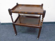 A two-tier barley twist tea trolley