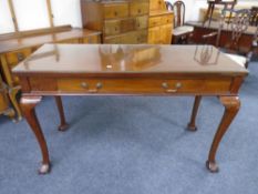 A 19th century glass-topped console table fitted a drawer,
