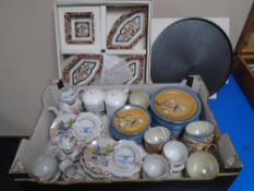 A Japanese ceramic hors d'oeuvres set together with a box of Japanese teaware.