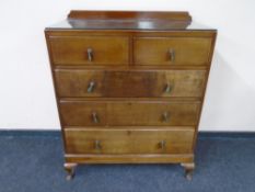 An Edwardian five drawer chest