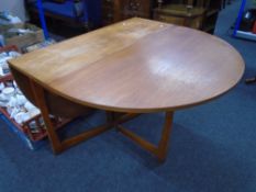 A 20th century teak drop leaf table
