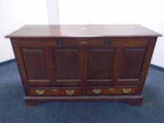 A George III oak mule chest with carved initials AP,