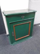 A 19th century painted mahogany panel door wall cabinet fitted with a drawer.