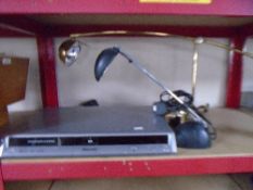 A Panasonic DVD recorder together with two angle poise table lamps on weighted bases.