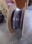 A spool of black Excel fibre optic cable.