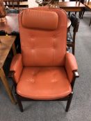 A Scandinavian stained beech armchair with head rest