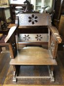 An early 20th century carved beech wood armchair.