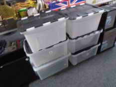 Six plastic storage crates.