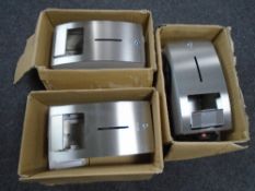 Three Franke stainless steel paper towel dispensers.