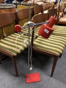 A mid-20th century angle poise floor lamp.