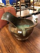 A 19th century copper and brass porcelain handled coal bucket