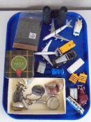 A tray of die cast model vehicles, binoculars, hair trimmers,