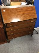 An Edwardian mahogany writing bureau fitted with four drawers, width 90 cm.