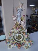 An early 20th century continental encrusted porcelain mantel clock
