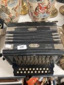 A Continental melodian squeeze box