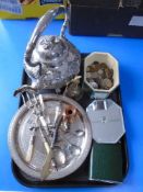 A tray of containing a mirrored glass casket containing coins, a silver plated tray,