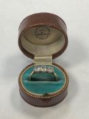 An 18ct yellow gold three stone diamond ring, size P, 2.8g, approximately 1ct in total.