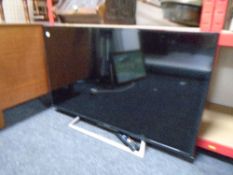 A Sony KDL40R553C TV with lead and remote.