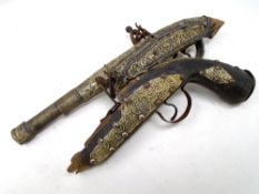 Two 18th century black powder pistols.