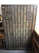 A 20th century oak gothic style three piece bedroom suite.