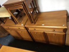 A pair of Sutcliffe furniture double door cabinets, fitted with a drawer.