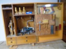 A 20th century painted pine workshop cabinet containing an assortment of hand tools including