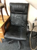 An executive high backed swivel armchair.