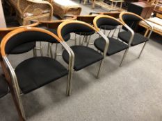 A set of four Sorensen contemporary armchairs on tubular metal legs