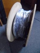 A spool of black fibre optic cable.