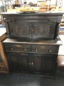 A carved oak buffet back sideboard.