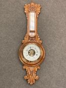 An Edwardian oak aneroid barometer