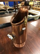 A 19th century copper and brass porcelain handled coal bucket