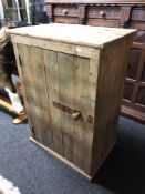 An antique pine cupboard.