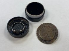 A Luftwaffe type badge with pin back, together with white metal skull ring.