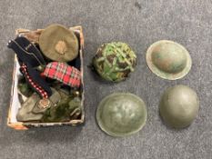 Four British Army metal helmets together with various other military related hats.