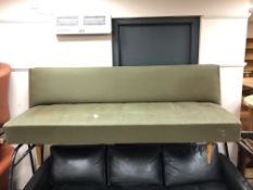 A mid-20th century Danish day bed on teak legs.