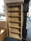 A pine open bookcase.