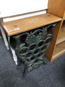 A wrought iron pine topped wine rack, height 72 cm, width 53 cm.