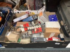 A tool box and box containing hardware, fan belts, wall plugs,