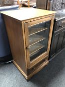 An Ercol elm and beech Canterbury audio cabinet.