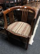 A 19th century inlaid mahogany open tub chair.