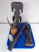 A tray of carved wooden figures, ornaments,