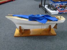 A pond yacht on stand.