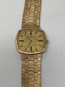 A Gentleman's 9ct yellow gold Longines wrist watch, gross 56.7g.
