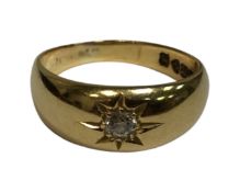 An 18ct yellow gold ring set with a diamond approximately 3 mm in diameter, 7.5g, size Q.