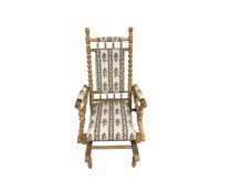 A 20th century blond oak rocking chair