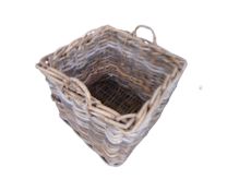 A large wicker twin handled log basket