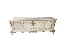 A continental cream and gilt four door buffet sideboard width 225 cm
