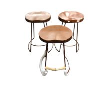 Three contemporary breakfast bar stools on metal legs