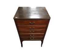 An Edwardian five drawer music chest on raised legs,